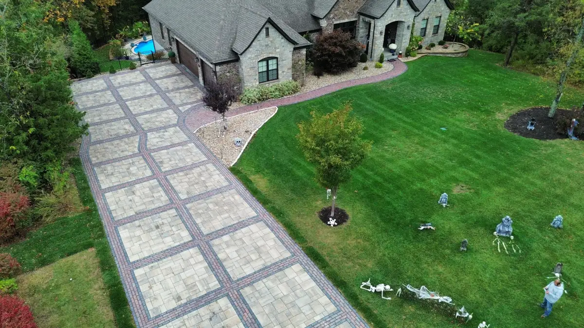 Award-winning paver driveway with brick accent bands by Green Operations in St. Louis