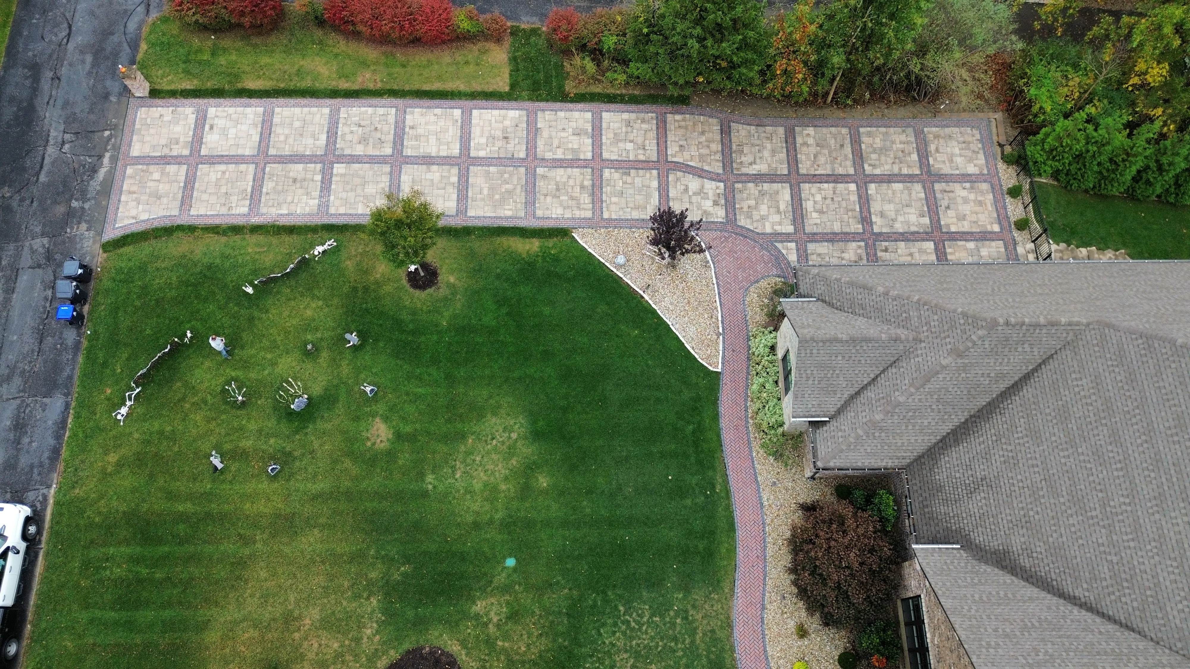 Aerial view of paver driveway and property serviced by Green Operations