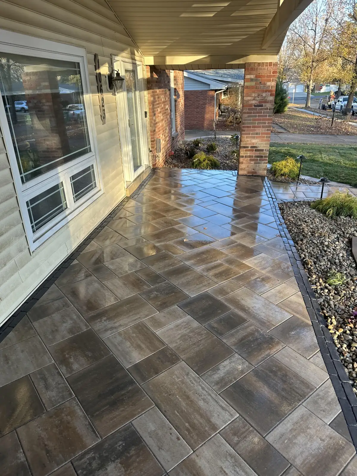 Custom herringbone paver patio with autumn landscaping by Green Operations in St. Louis