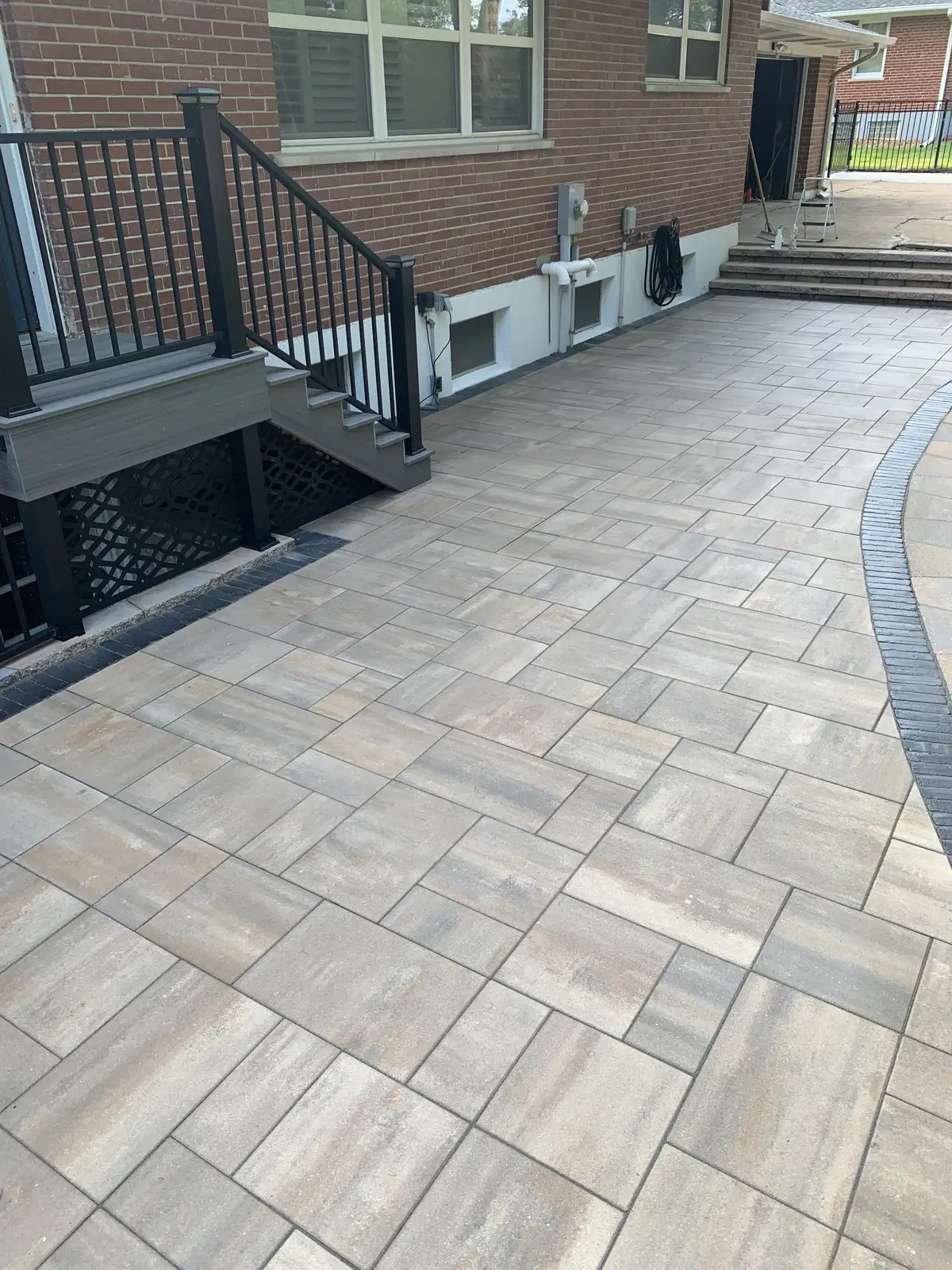 Large format paver patio with accent border after sealing