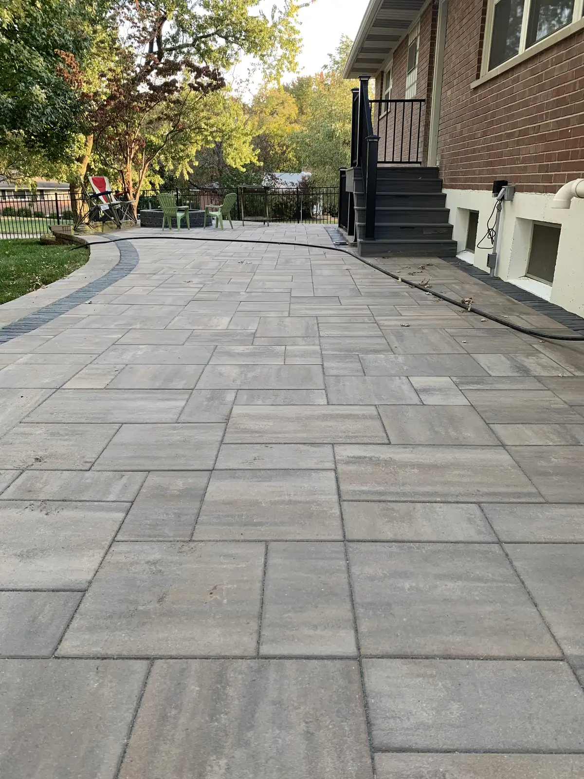 Large gray paver patio after professional cleaning