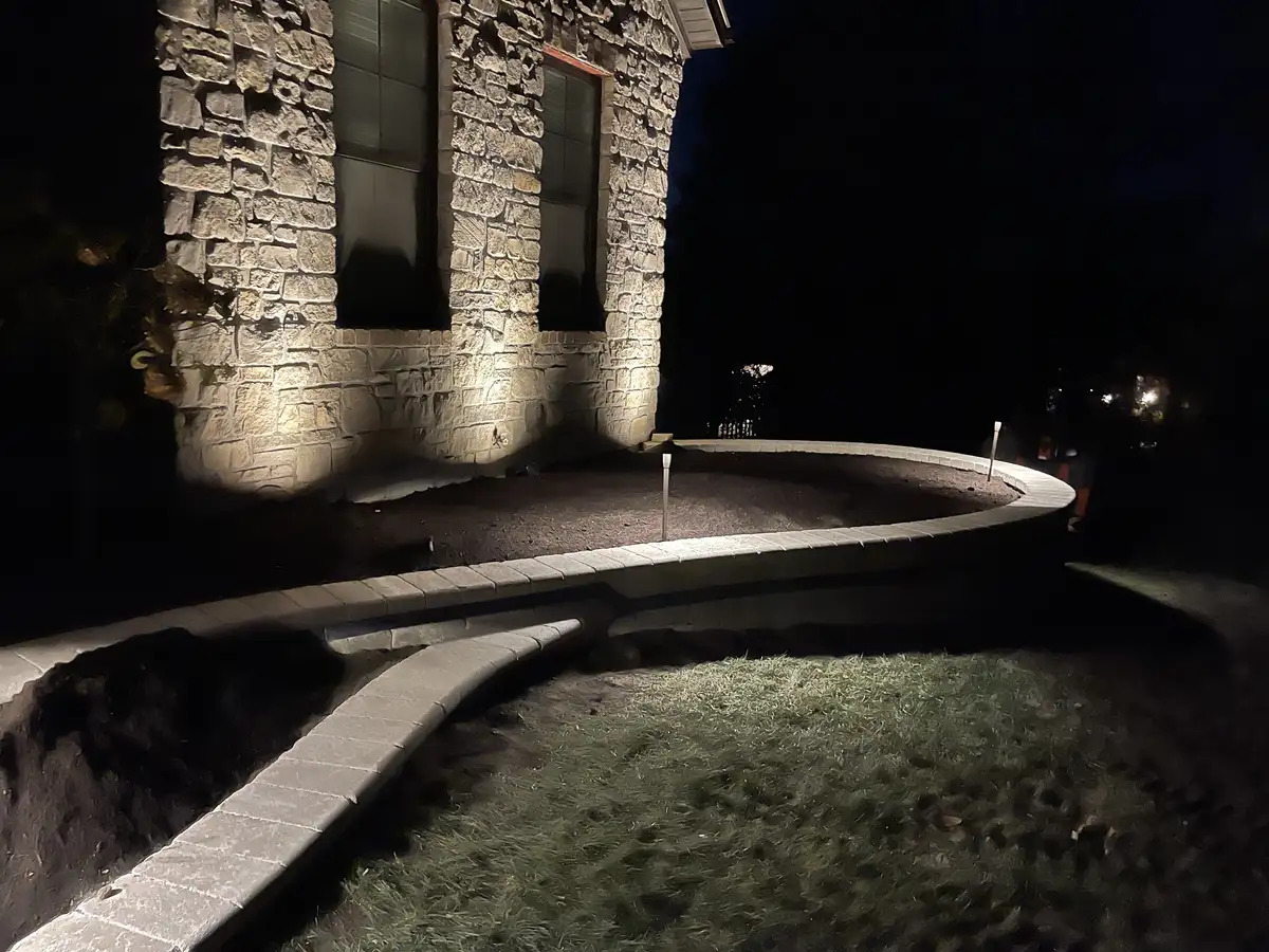 LED landscape lighting on retaining wall at night in St. Louis