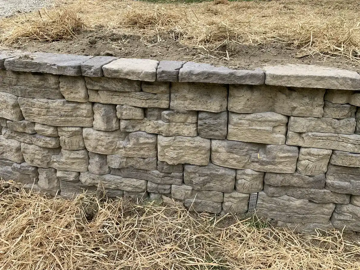 Natural stone retaining wall detail showing stacked limestone