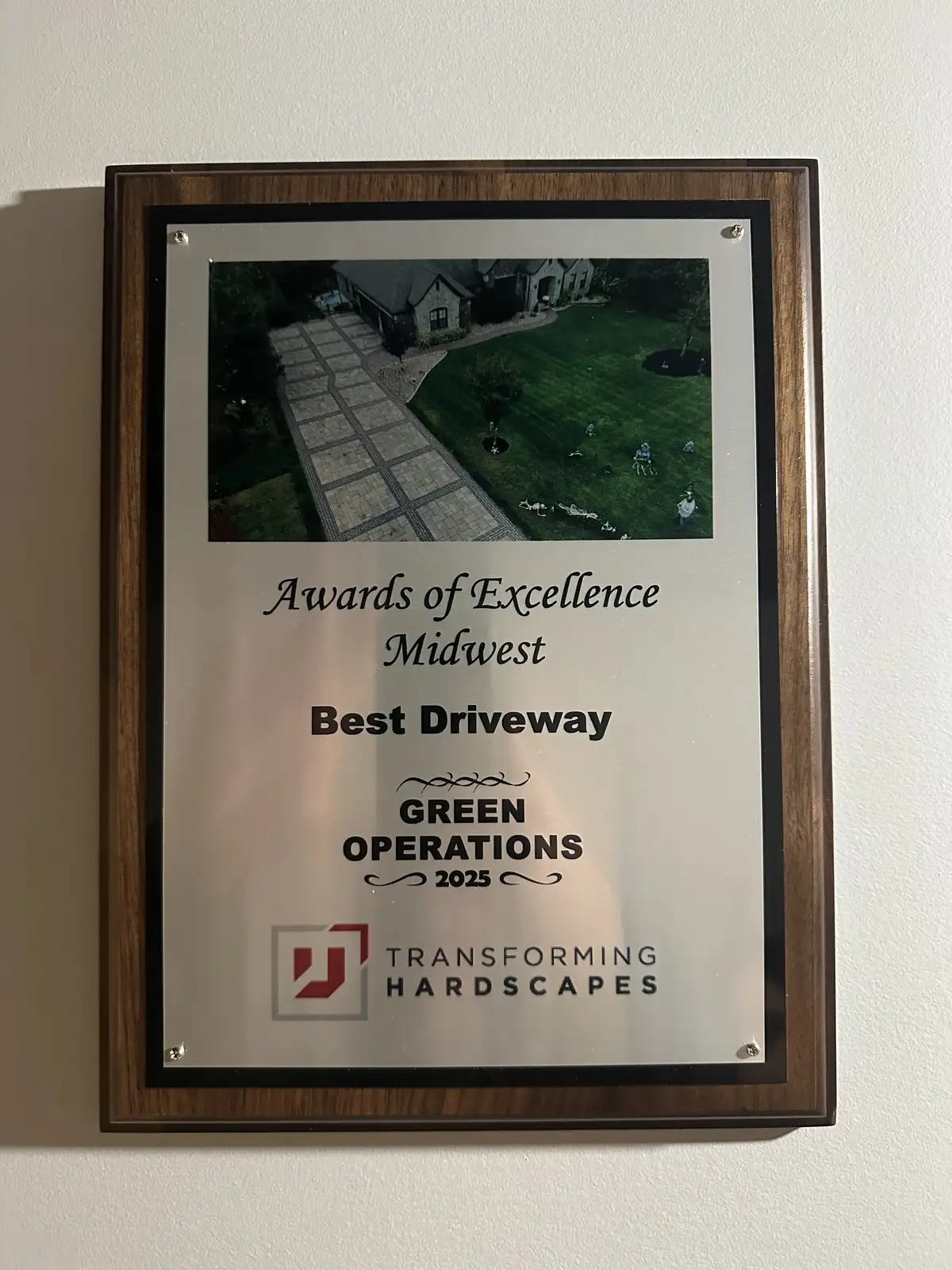 Green Operations 2025 Best Driveway Award plaque from Unilock